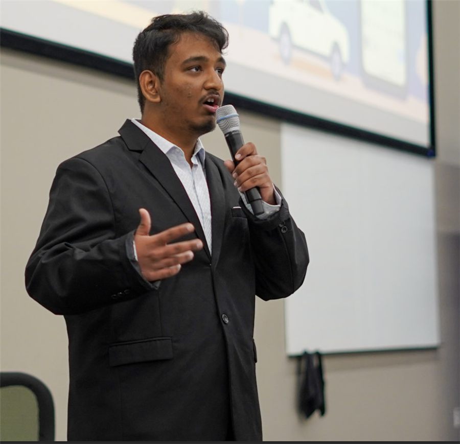 Arvindh presenting on stage